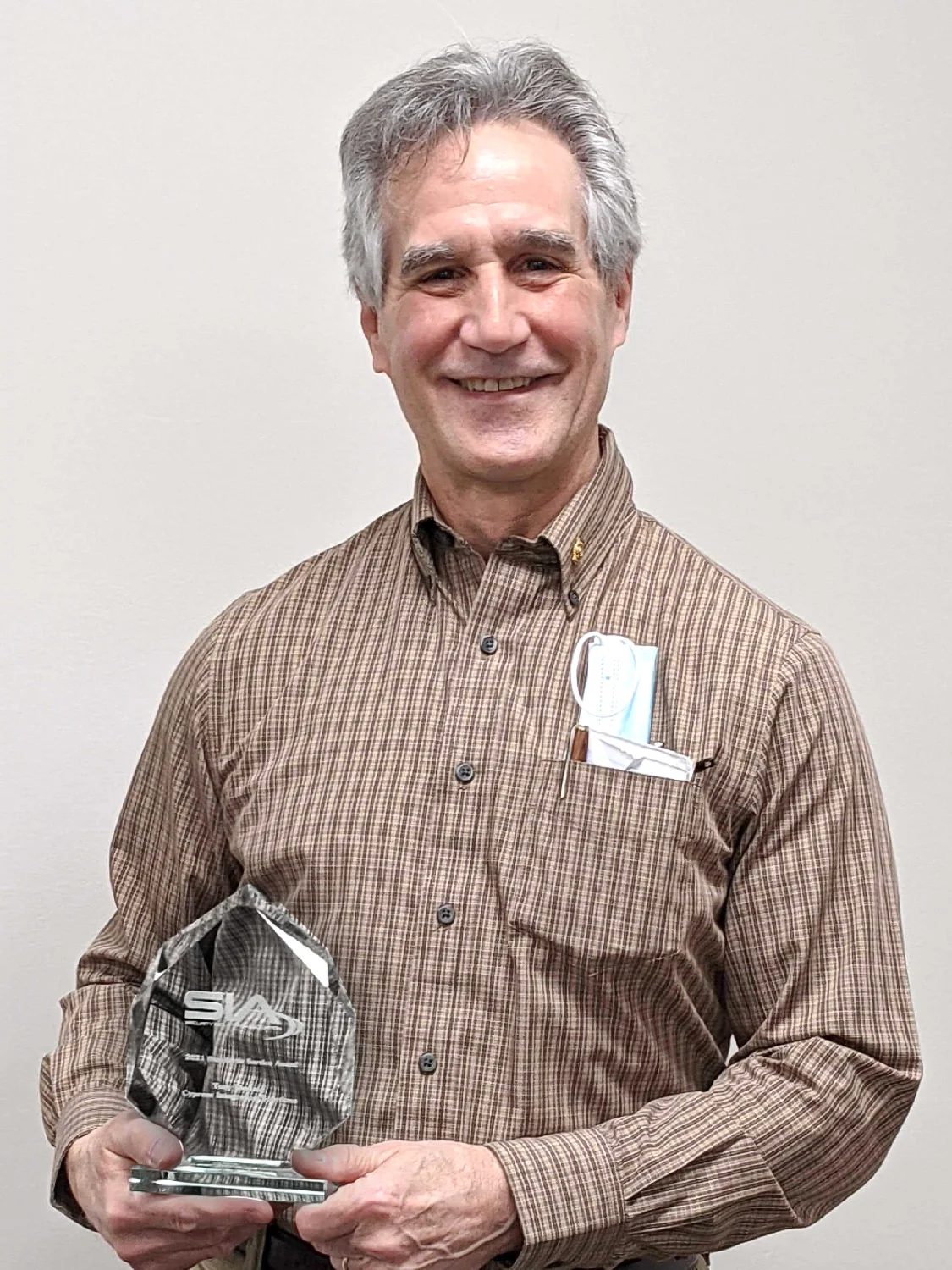 Tony Diodato holding the SIA Standards Service Award in 2021