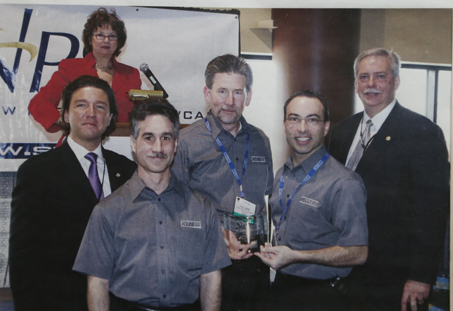 Cypress team members at an industry event