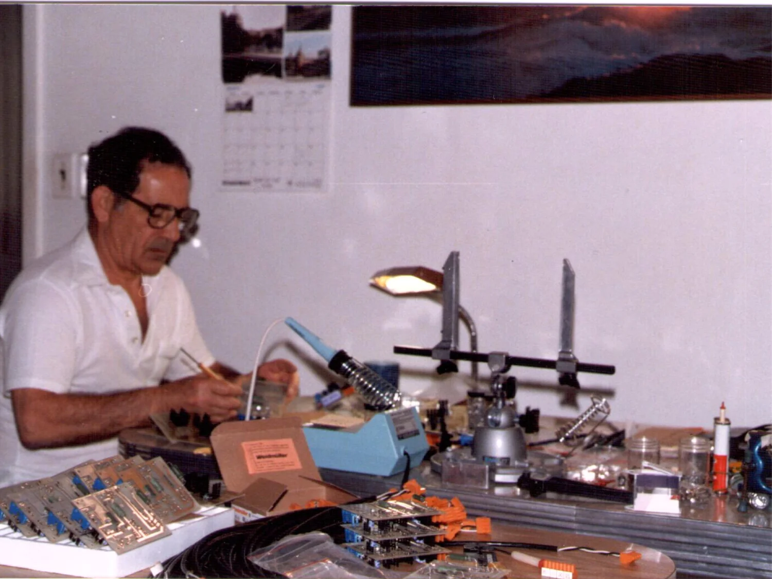 Early Cypress electronics assembly work at a circuit-board workbench